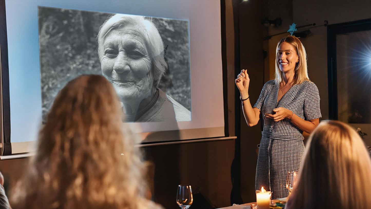 Moving Images tribute video displayed at a family gathering, honouring a lifetime of memories.